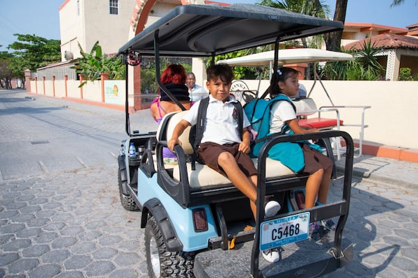 Kids on golf cart
